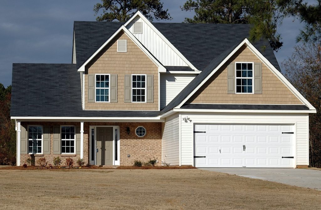 a house with a white garage door