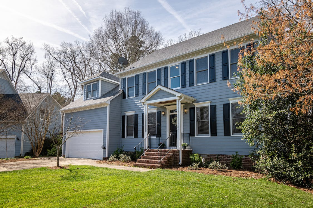 An image of a house with a white garage door