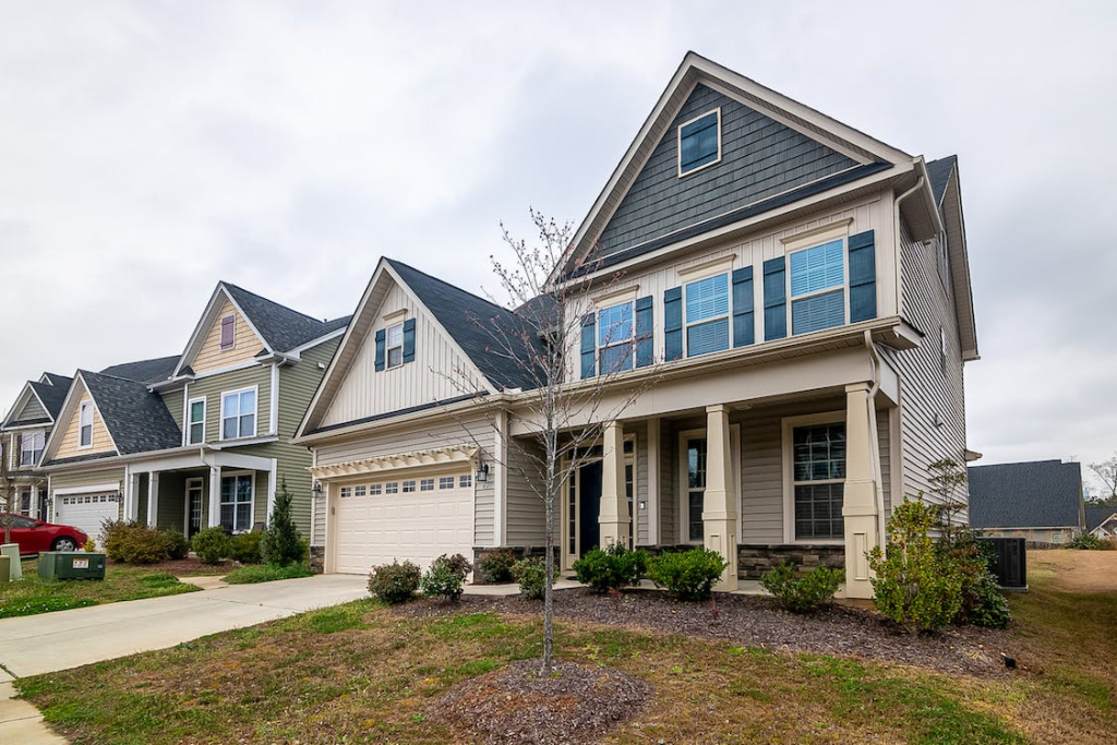 An image of a house with a white garage door