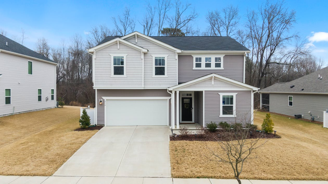 An image of a house with a white garage door