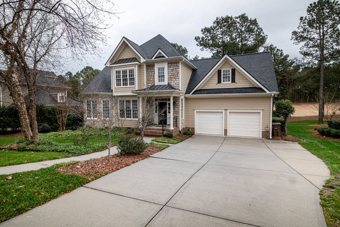 a garage door with a driveway.