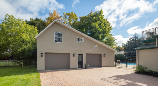  Garage with two beige garage doors.