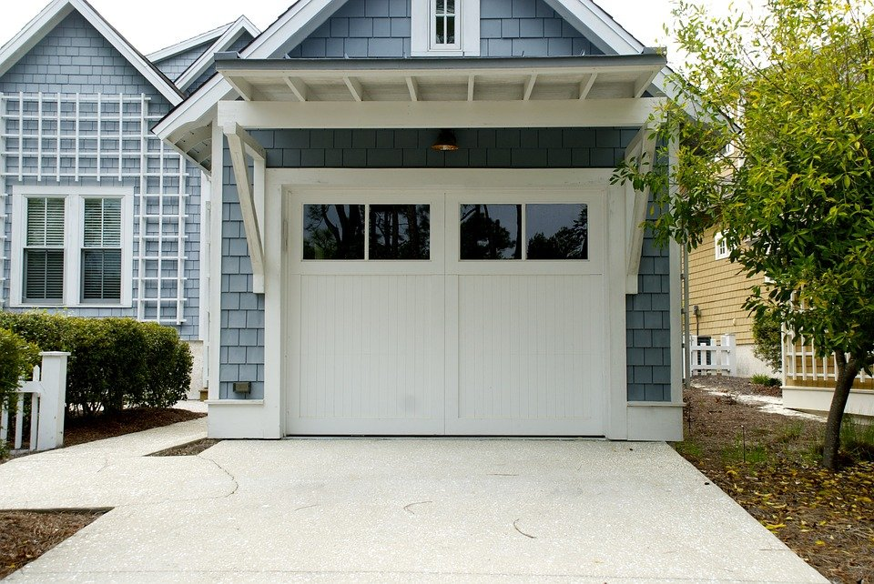 a home with a white garage door