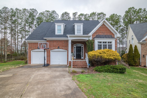 An image of a house with a white garage door