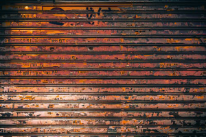 A rusted garage door showing signs of wear and corrosion