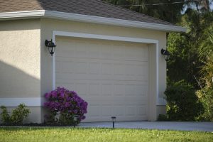 Wide garage double door and concrete driveway of new modern american house